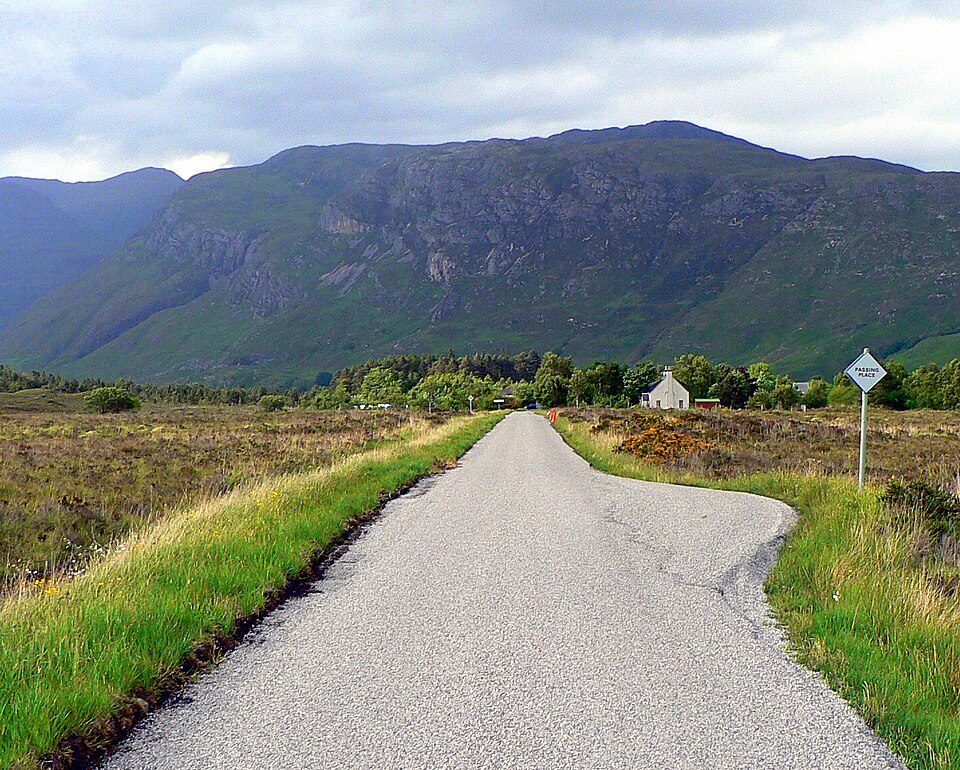 Single-track road in Kinlochewe, Scotland with a passing place